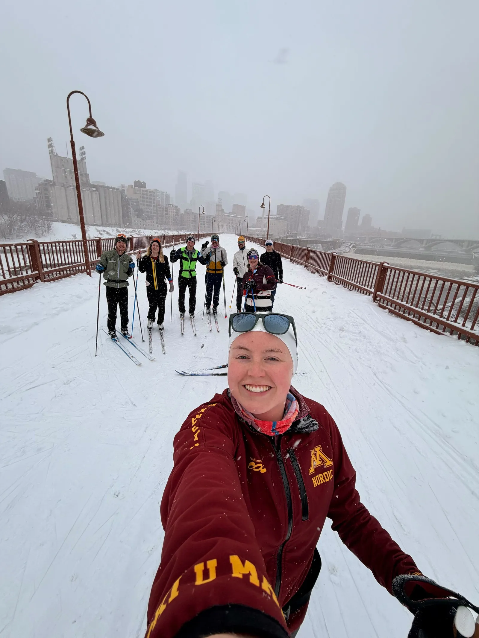 Run crew posing on the riverfront on the Boom Island to Stone Arch loop